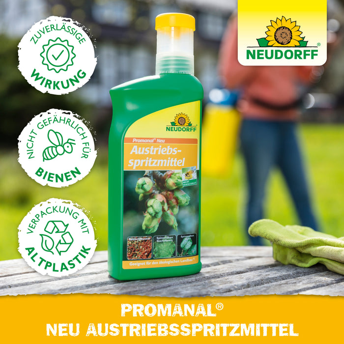 Neudorff Promanal Neu Austriebsspritzmittel Flasche auf einem Gartentisch mit Person im Hintergrund