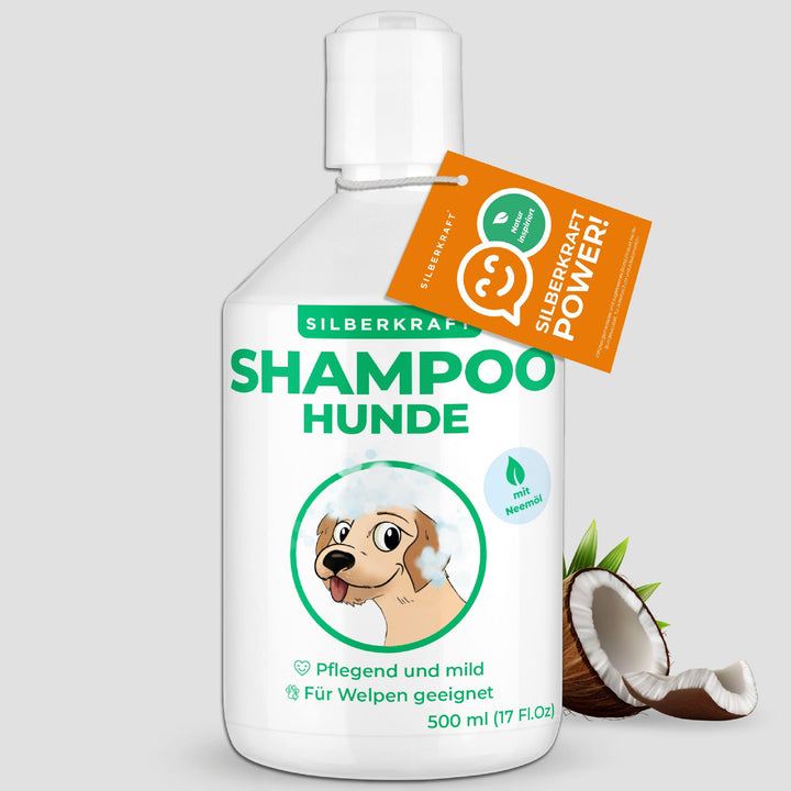 Neemöl Hundeshampoo in einer weißen 500-ml-Flasche mit Hunde-Illustration auf dem Etikett und einer frischen Kokosnuss.